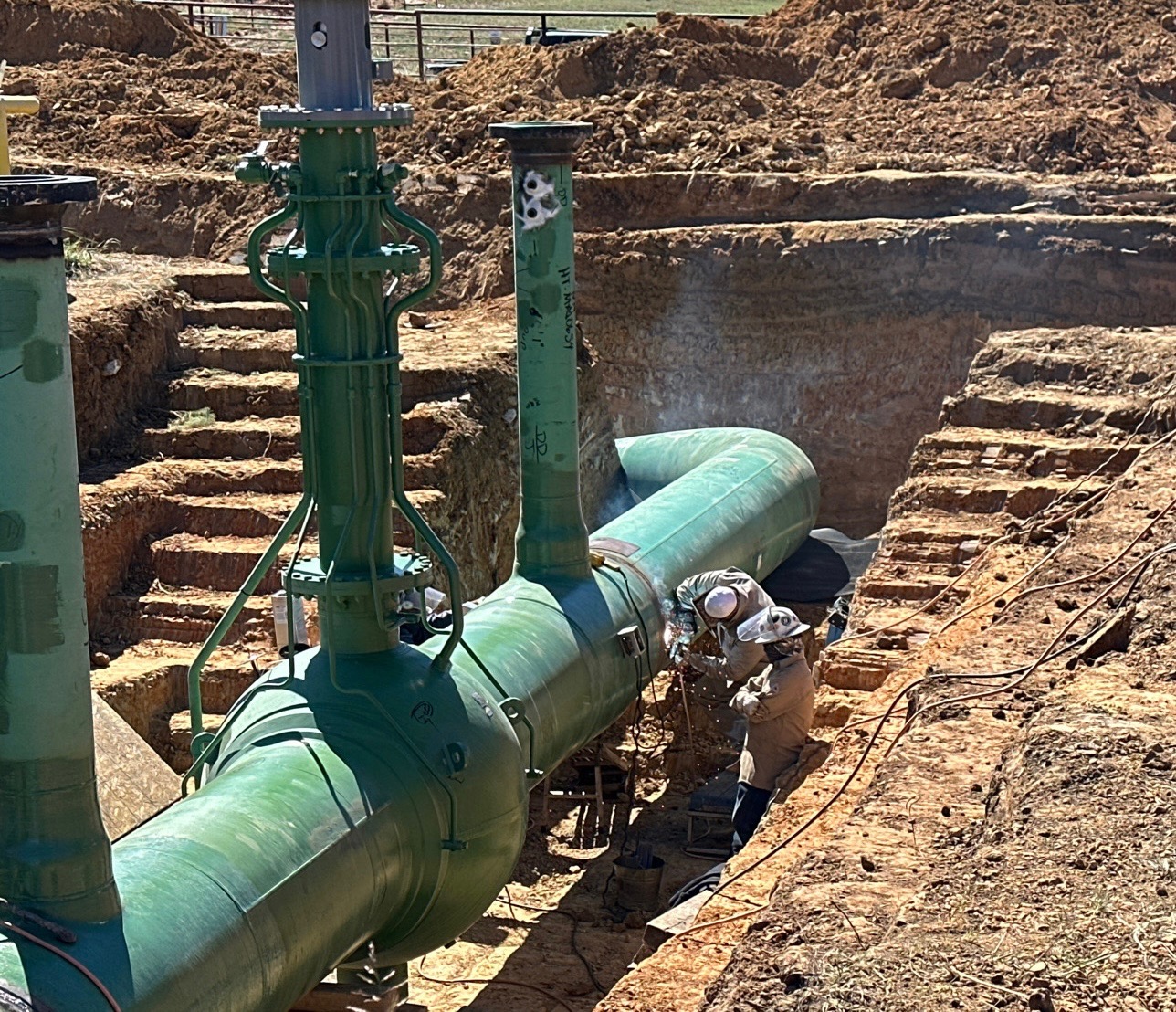 Field welding on a large pipeline in an excavated work area