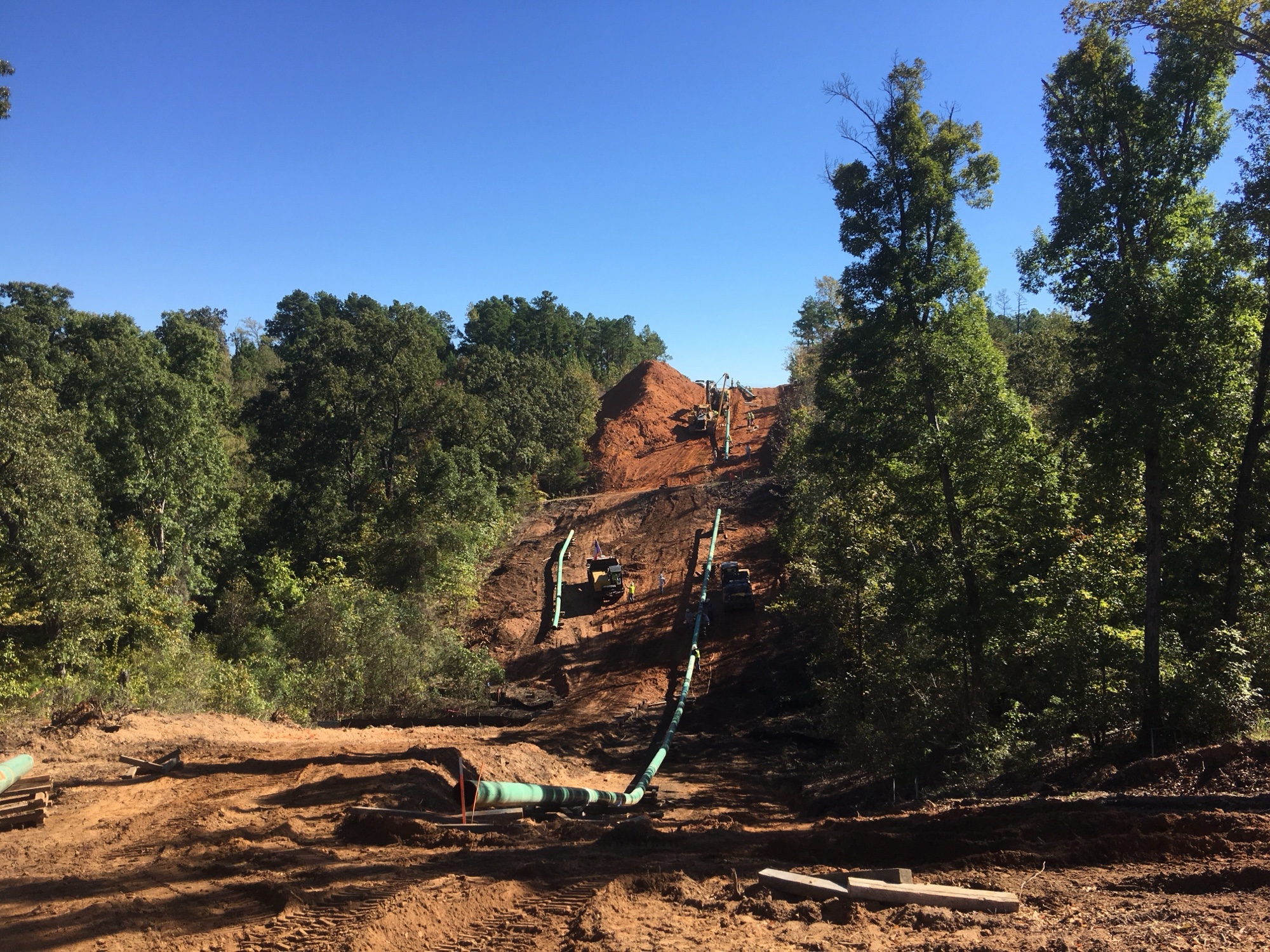Pipeline construction following a wooded hillside right-of-way