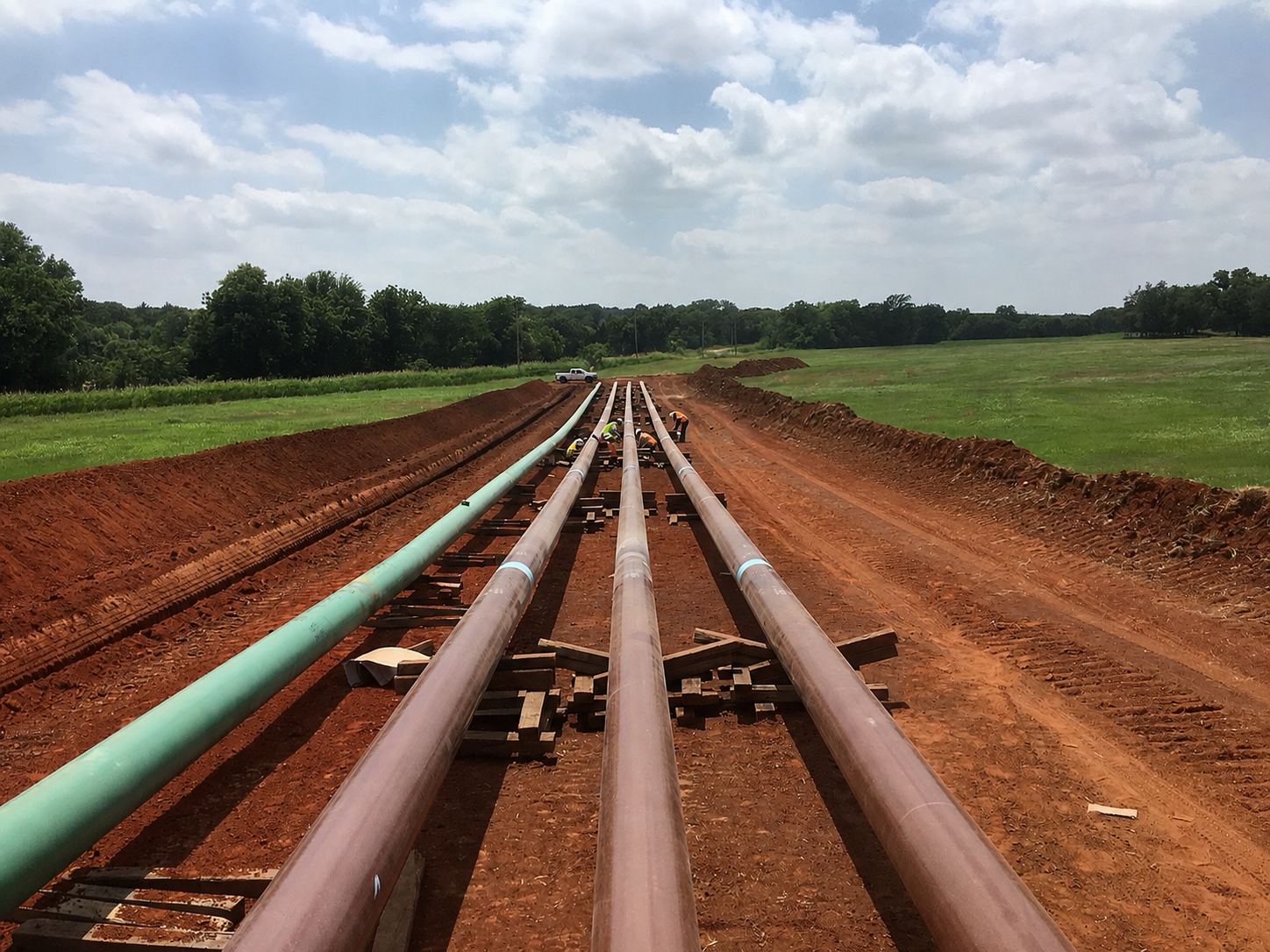 Pipeline construction crew and equipment